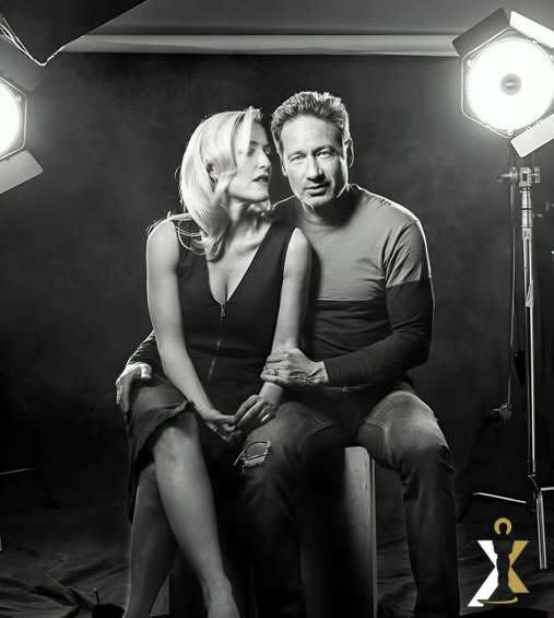 David Duchovny and Gillian Anderson in a black-and-white studio portrait